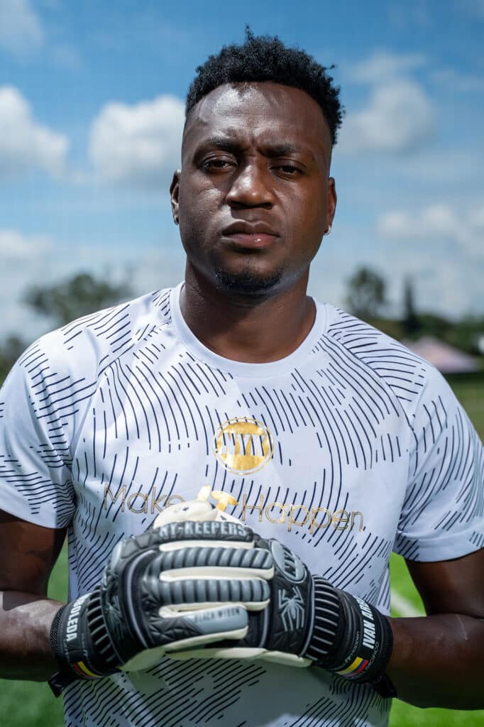 Iván Arboleda, Colombian goalkeeper for Millonarios FC wearing NYK pro gloves, strong and agile with global experience