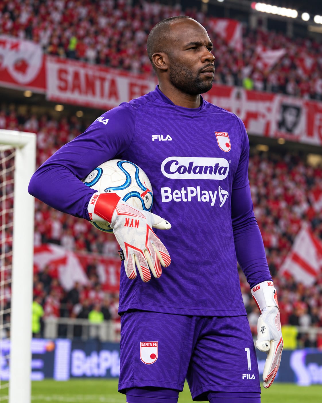 Andrés Marmolejo holding the ball in APEX gloves